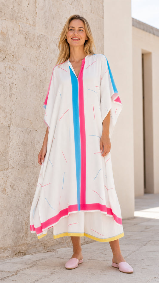 Front view of model wearing white geometric print kaftan maxi dress