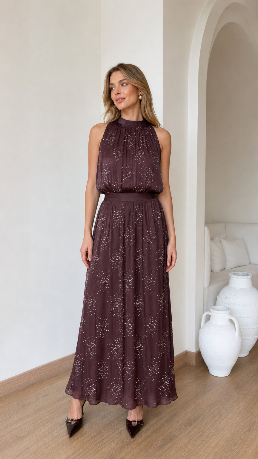 Front view of model wearing brown glitter chiffon halter maxi dress