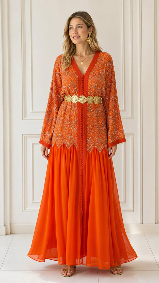 Model wearing bright orange embellished maxi kaftan dress from the front