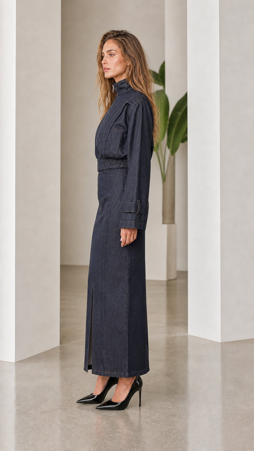 Side profile view of dark denim coordinate set with pointed heels