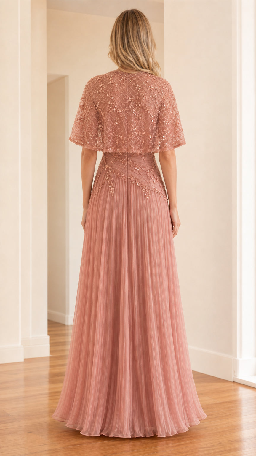 Back view of rose pink formal dress with flowing cape overlay