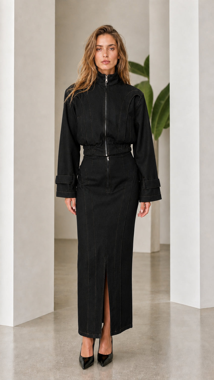 Front view of woman wearing black denim two-piece set