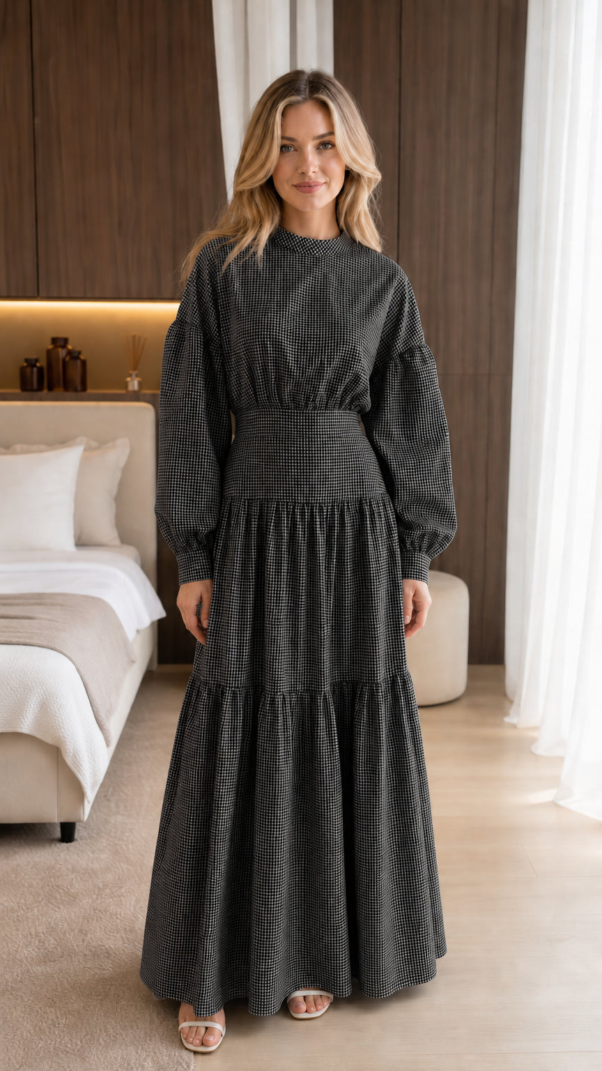 Front view of model wearing black gingham maxi dress