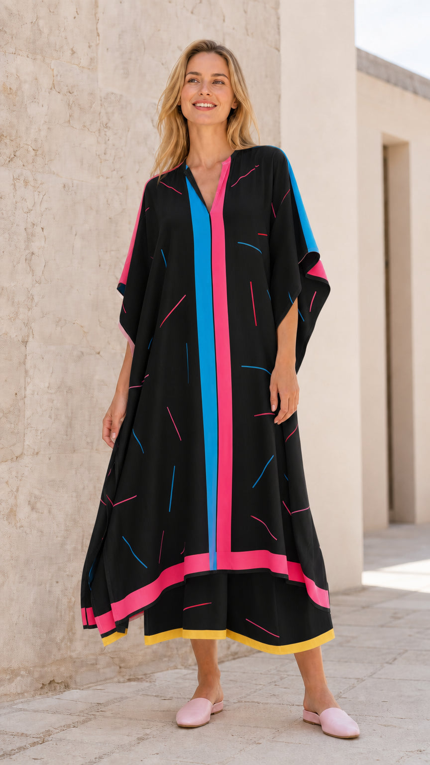 Front view of model wearing black kaftan maxi dress