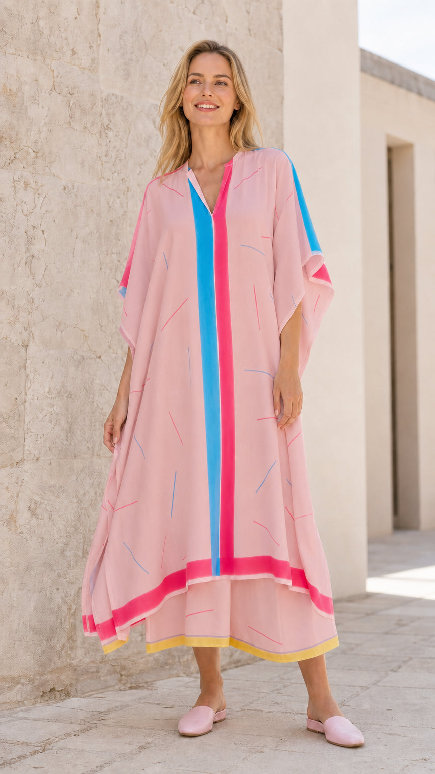 Front view of model wearing pink kaftan maxi dress