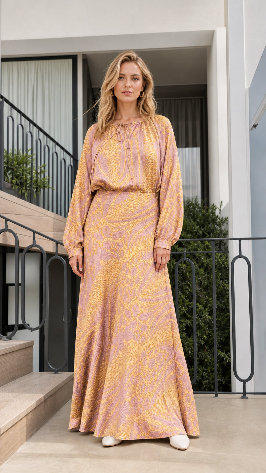 Model wearing pink printed long-sleeve maxi dress