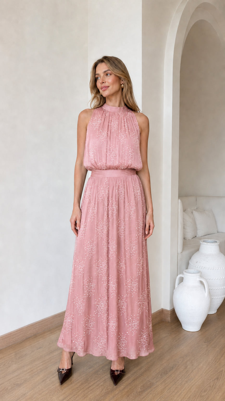 Front view of model wearing pink glitter chiffon halter maxi dress