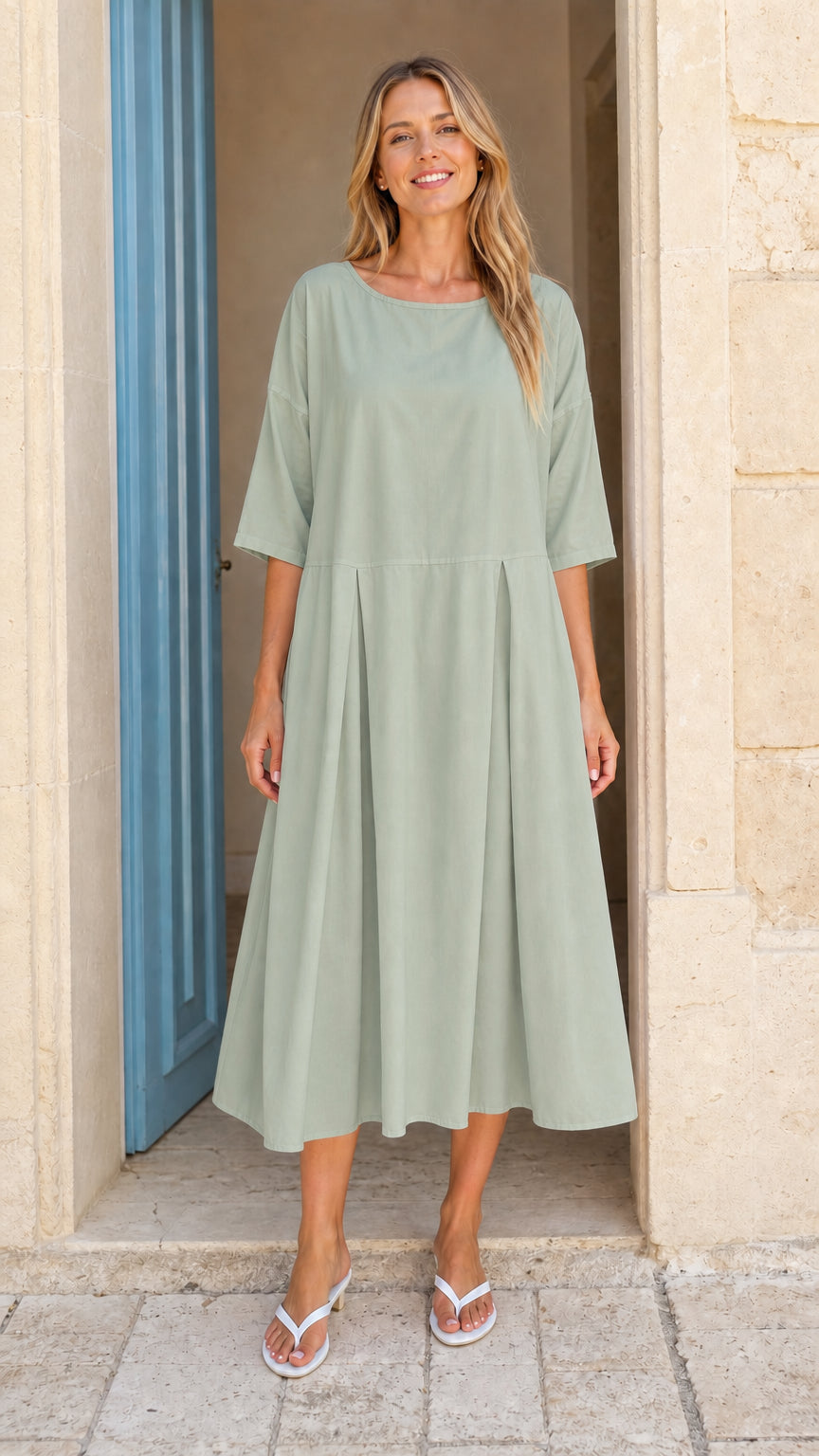Model wearing sage green casual pleated midi dress