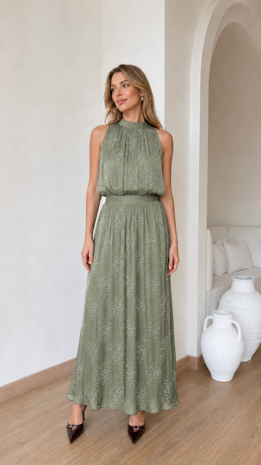 Front view of model wearing sage green glitter chiffon halter maxi dress