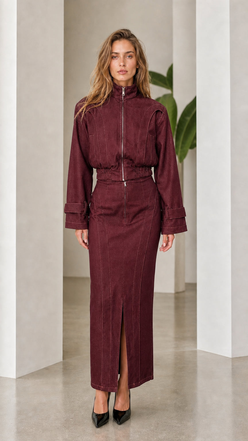 Front view of woman wearing burgundy denim two-piece set