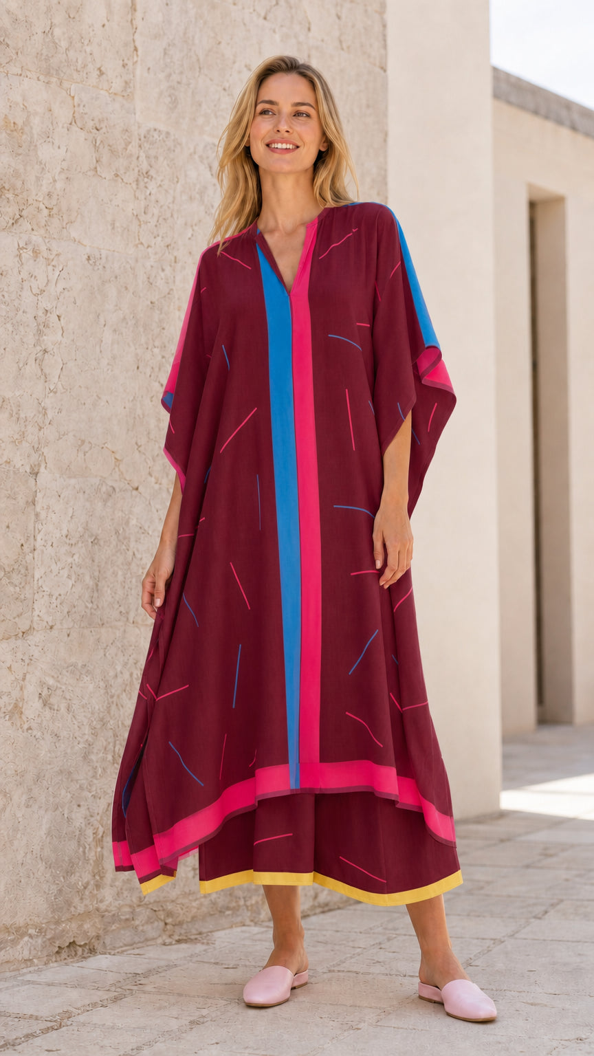 Front view of model wearing burgundy kaftan maxi dress