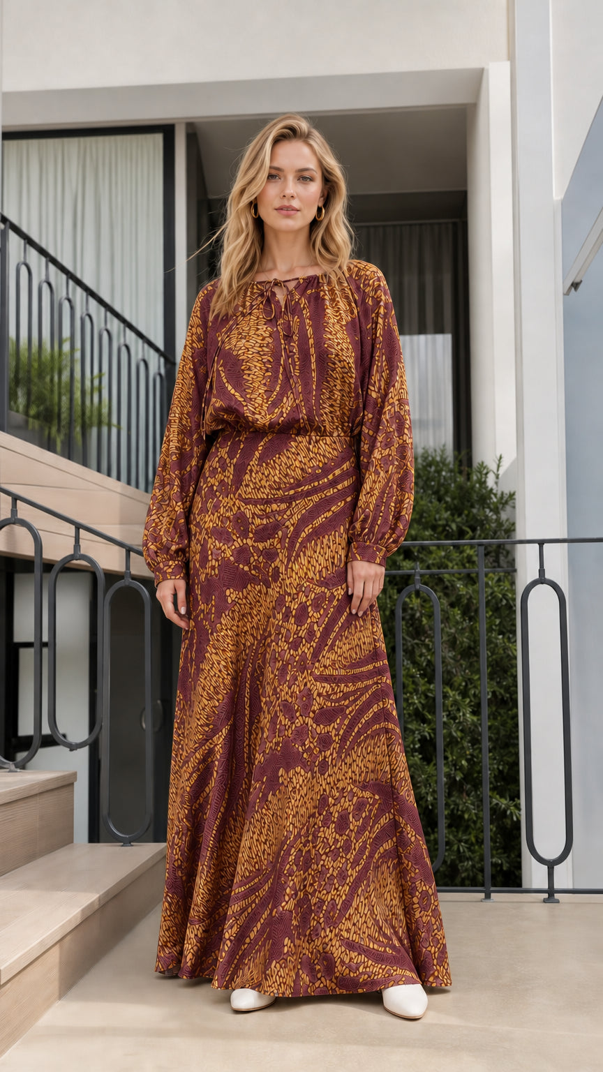 Model wearing burgundy printed long-sleeve maxi dress